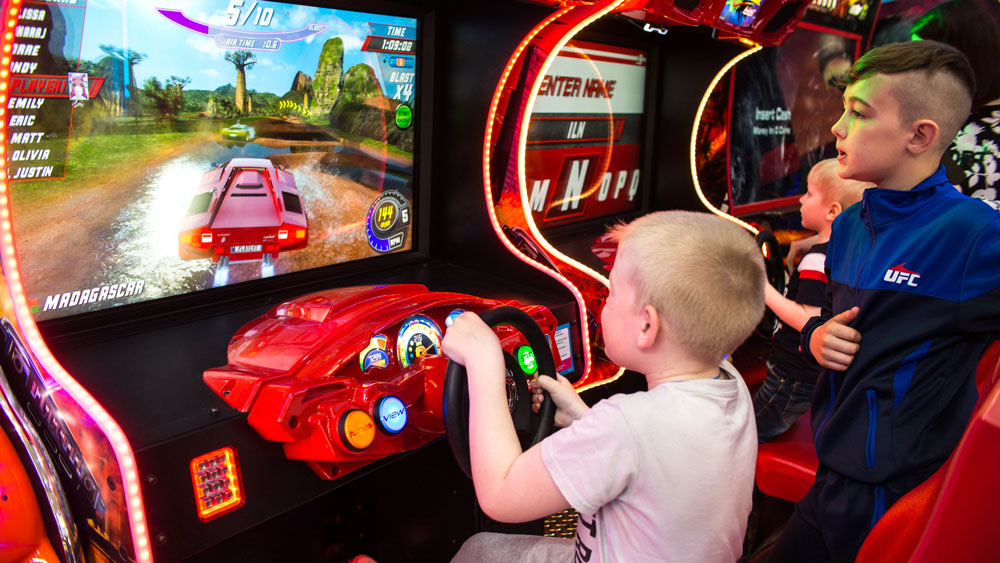 Children on Driving Game at Ladram Bay Amusements